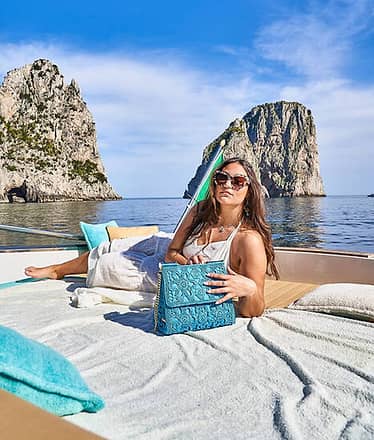 Transfer by boat to Capri beach clubs