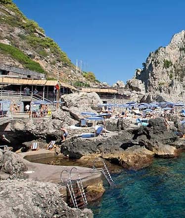 Transfer by boat to Capri beach clubs