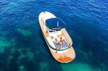 Capri aboard a private boat from Naples or Sorrento