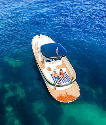Capri aboard a private boat from Naples or Sorrento