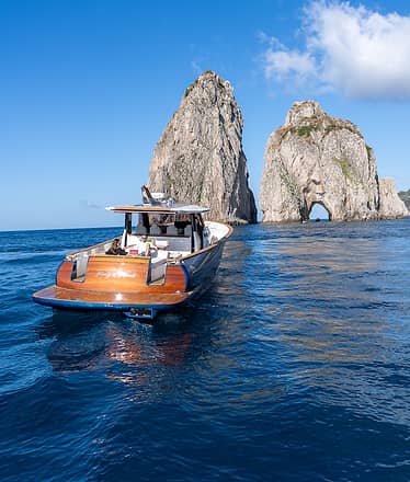 Capri by boat: grottoes, Faraglioni and natural wonders