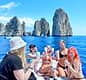 Group tour to Capri on a traditional boat: Faraglioni and grottoes at sea