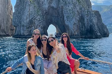 Group tour to Capri on a traditional boat: Faraglioni and grottoes at sea