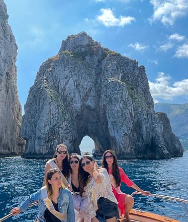 Group tour to Capri on a traditional boat: Faraglioni and grottoes at sea