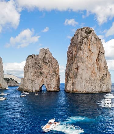 Boat Tour in Capri: 8-Hour Exclusive Experience with Caves, Faraglioni Rocks and Crystal-Clear Sea