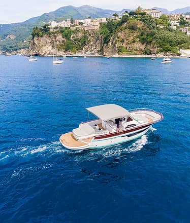 Premium private boat tour to Amalfi and Positano with islands, villages and sea views