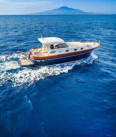 Premium private boat tour to Amalfi and Positano with islands, villages and sea views