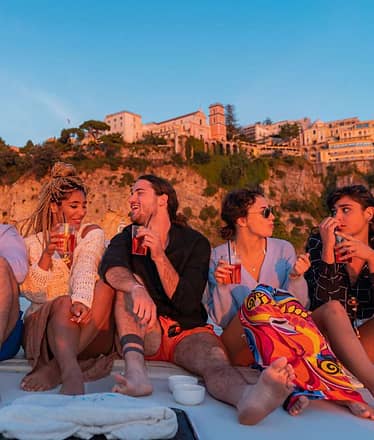 Sunset Boat Tour along the Sorrento Coast with Aperitif and Golden Views