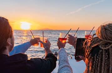 Sunset Boat Tour along the Sorrento Coast with Aperitif and Golden Views