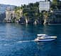 Tour in barca al tramonto lungo la costa di Sorrento con aperitivo a bordo