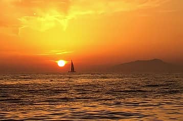 Sunset Sail with Cocktails beneath the Faraglioni