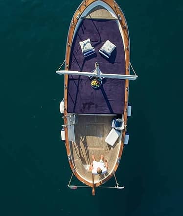 Capri in gozzo , swimming and Faraglioni Rocks